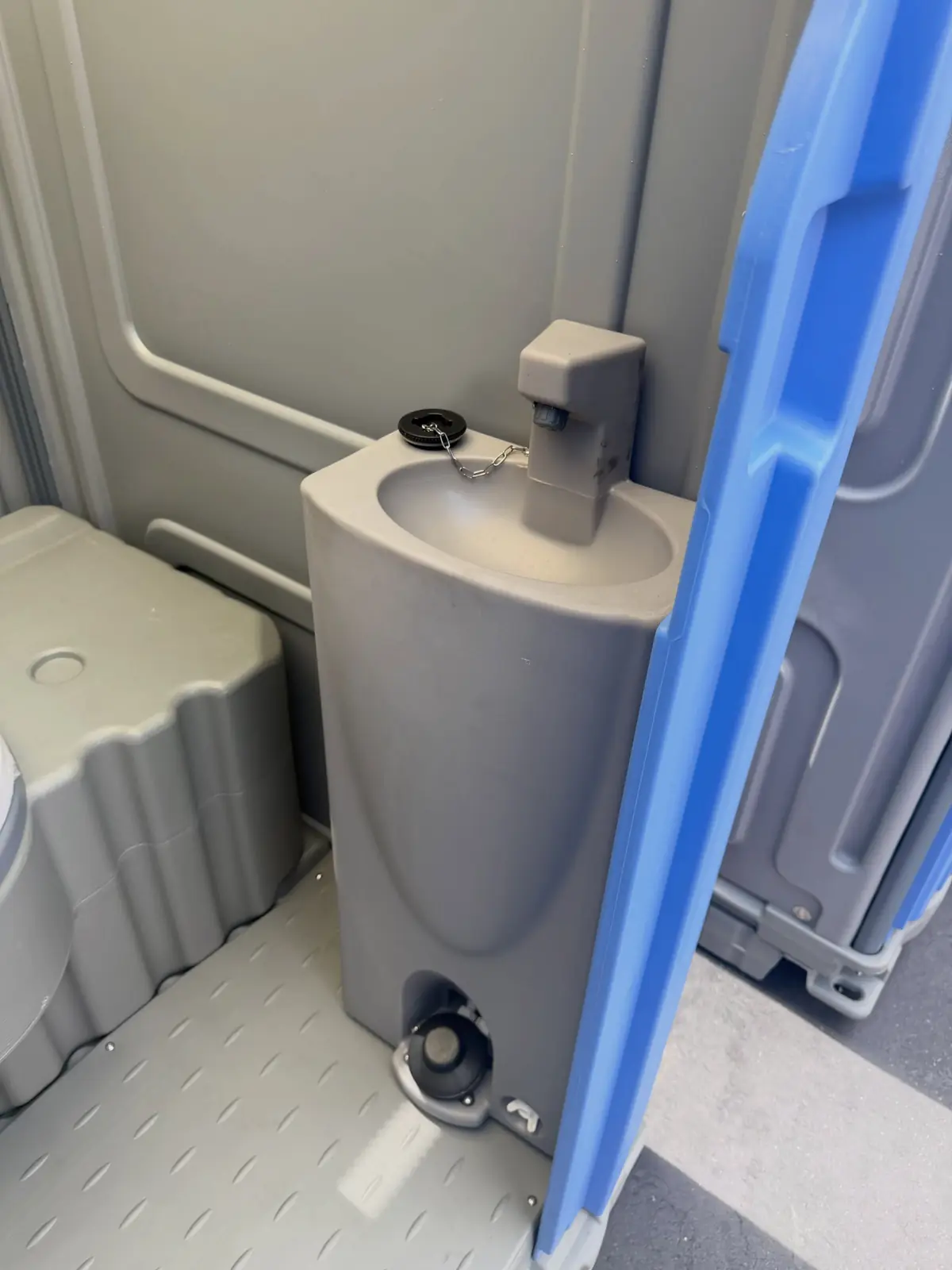 Sink and mirror inside a deluxe flushing unit