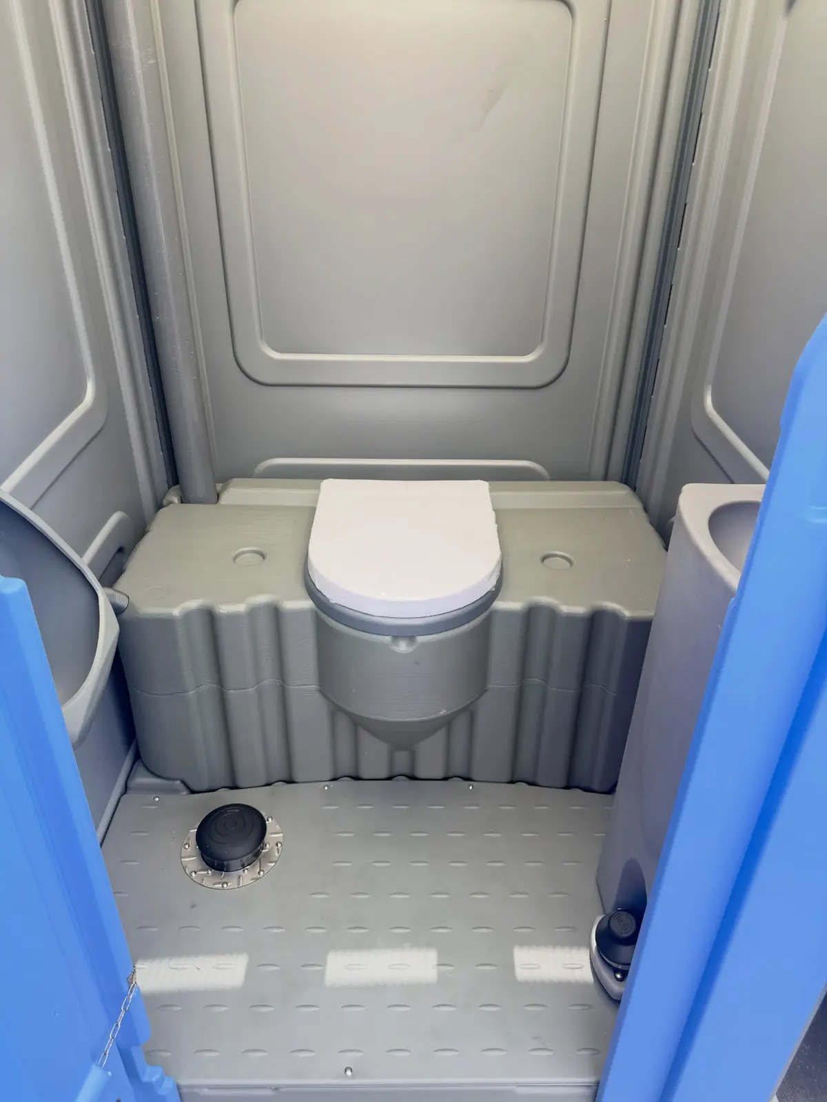 Roomy interior of a wheelchair-accessible portable toilet